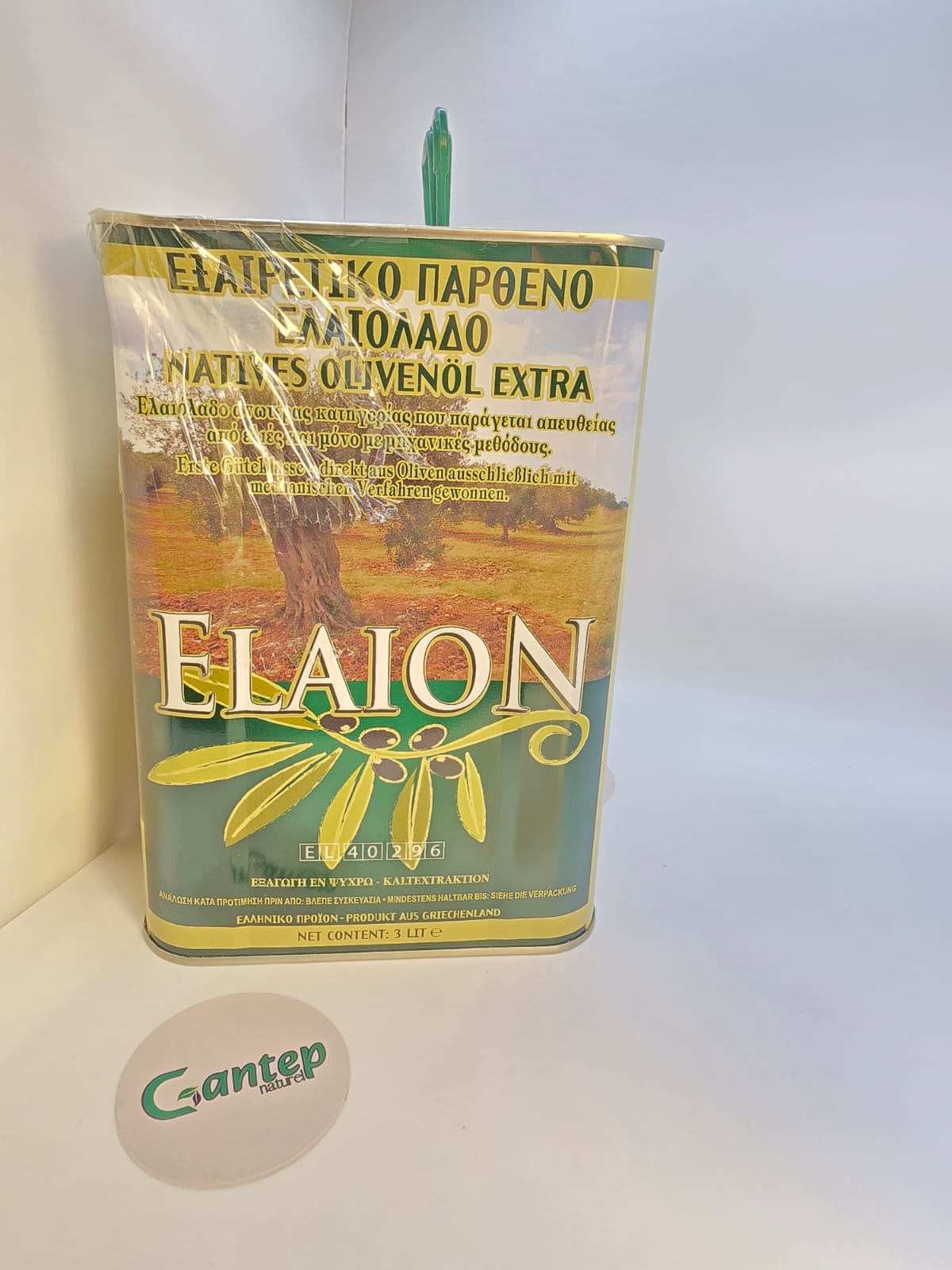 Elaion Natives Olivenöl Extra im 3-Liter-Metallkanister, goldgrün gestaltet mit Olivenzweigmotiv und griechischer Landschaft.