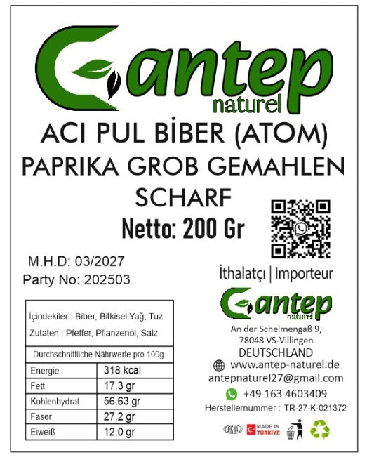 Nahaufnahme des Produktetiketts für Aci Pul Biber (Atom) – grob gemahlene, scharfe Paprika von Gantep Naturel, mit Inhaltsangaben, Nährwerttabelle und Kontaktinformationen.