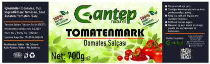 Produktetikett des Gantep Naturel Tomatenmarks mit Inhaltsangabe, Lagerungshinweisen und Importeurinformationen auf hellem Hintergrund.